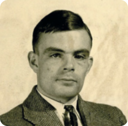 Fotografia em preto e branco de Alan Turing. Ele é um homem branco com expressão neutra e está usando terno e gravata.