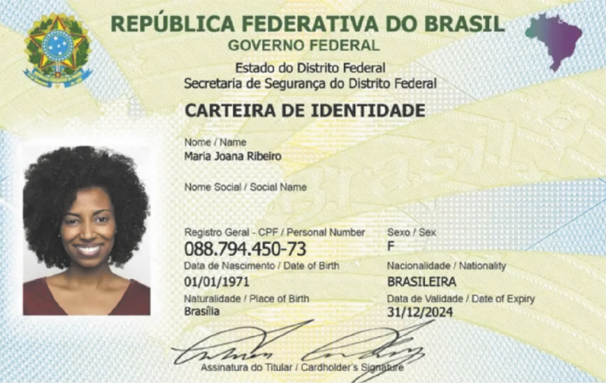 Fotografia do documento de identidade de uma mulher. À esquerda está a foto da mulher. À direita, estão as seguintes informações: 'Nome: Maria Joana Ribeiro', 'Registro geral - CPF: 088.794.450-73', 'Data de nascimento: 1 de janeiro de 1971', 'Naturalidade: Brasília', 'Sexo: F', 'Nacionalidade: Brasileira', 'Data de validade: 31 de dezembro de 2024'. Abaixo destas informações está a assinatura da mulher.