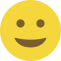 Emoji formado por um círculo amarelo, com olhos pretos e um sorriso discreto.