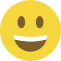 Emoji formado por um círculo amarelo, com olhos pretos e um sorriso largo que mostra os dentes.