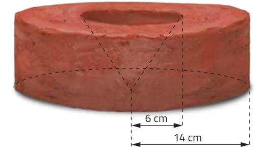Imagem de um cilindro com cavidade central em forma de cone invertido. Linhas tracejadas indicam a estrutura do cone, que ocupa toda a altura do cilindro. A base do cilindro possui raio de quatorze centímetros, e a base superior da cavidade cônica tem raio de seis centímetros.