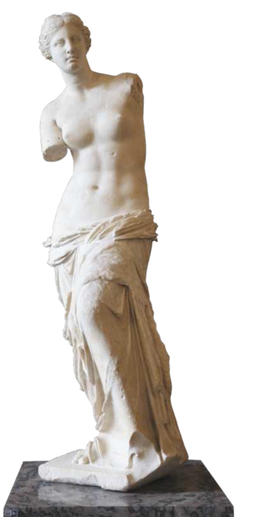 Fotografia de escultura representando uma mulher em pé, com os cabelos cacheados e o tronco nu, vestida com tecidos enrolados abaixo da cintura e sobre as pernas. Os braços estão ausentes, e ela está com o corpo levemente inclinado para o lado, com uma das pernas levemente flexionadas, erguendo um dos joelhos à frente.