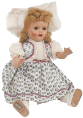 Imagem de boneca com vestido estampado e touca.