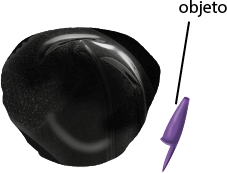 Ilustração de uma massa magnética preta, em formato irregular e ao lado uma tampa de caneta com a indicação de objeto.