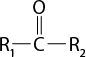 Estrutura química formada por símbolos de elementos químicos e linhas. Há um grupo R índice 1 que se liga a um elemento C central que se liga a outro grupo R índice 2, à direita, ambos por linhas simples. C também está ligado a um elemento O acima, por linha dupla.