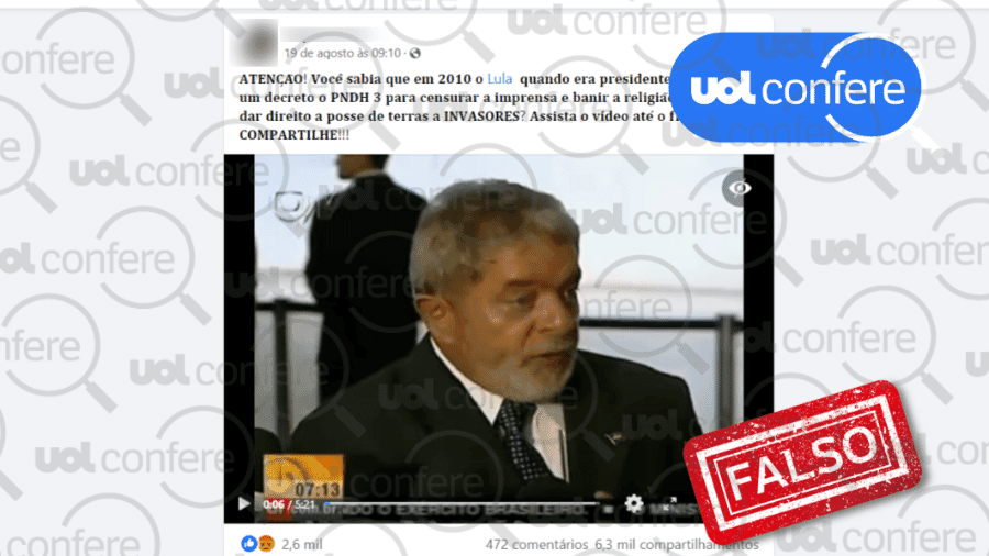 Reprodução de página de internet. Na parte superior há um texto de notícia falsa. Em seguida, player de vídeo com a imagem de Lula, homem de cabelo e barba grisalhos, vestindo terno. Ao lado, selo azul com a inscrição: uol confere. Abaixo, quadrado vermelho com a inscrição FALSO.