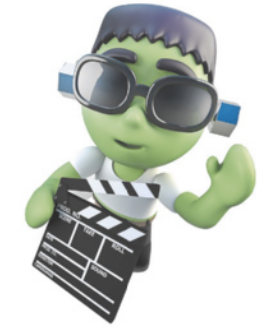 Imagem do boneco Frankestein segurando uma claquete e acenando.